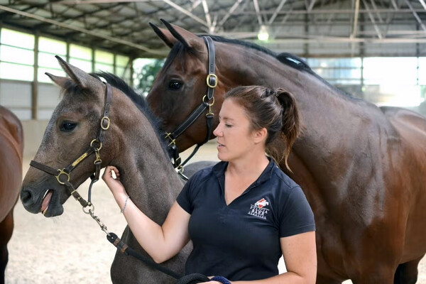 Fylicia Barr with a young foal.
