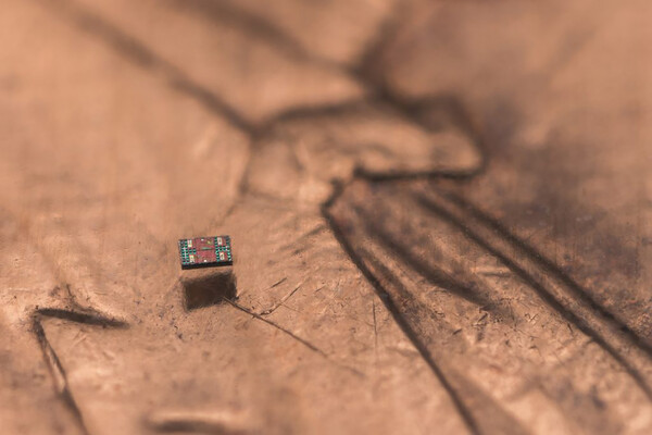 A microscopic robot on a U.S. penny for scale.