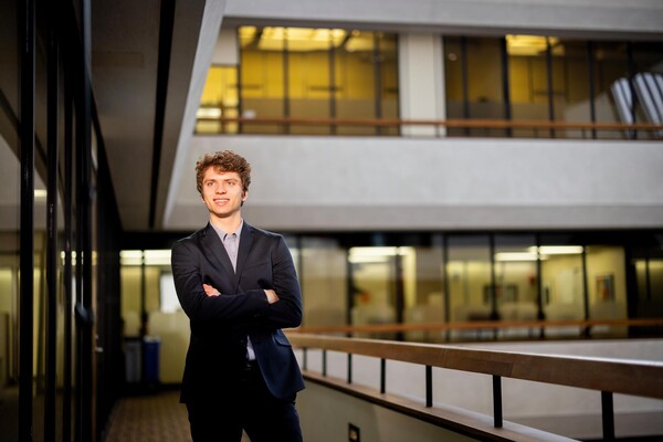 Stefan Hatch stands in the McNeil Building.