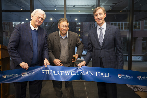 Fritz Steiner, Stuart Weitzman, and J. Larry Jameson cutting the ribbon to the new Weitzman Hall.