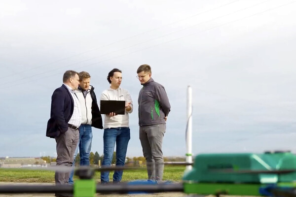 nirby pip prize winner working on a laptop in a field