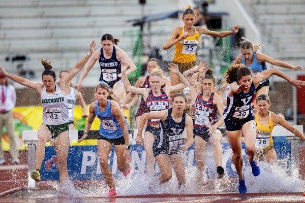 Runners running the steeplechase at Penn Relays.