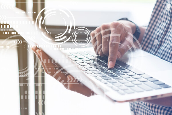 A person with a computer using AI in their search.
