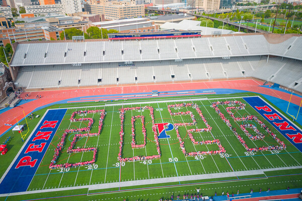 Penn’s Class of 2026 in formation on franklin field depicting the number 2026.