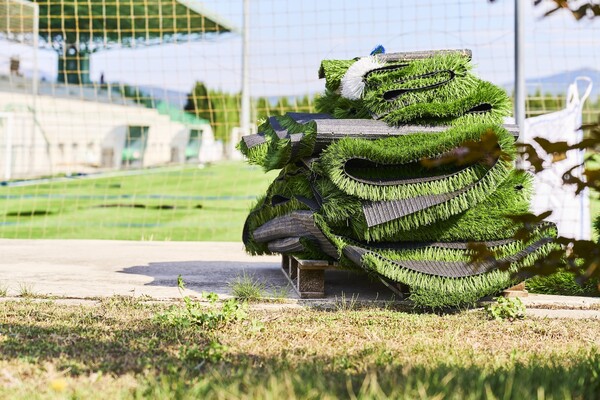 View of a pile of artificial turf of a soccer field.
