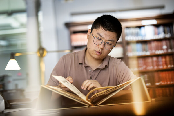 Second-year David Sun examines primary source documents at the Historical Society of Pennsylvania for his Revolutionary Stories project.