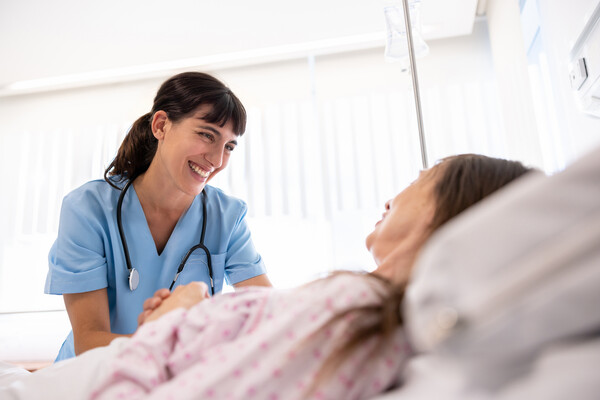 A nurse with a hospitalized patient.