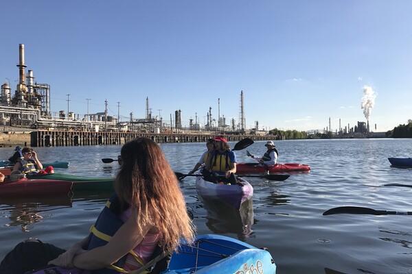People kayak on the Schuylkill River.