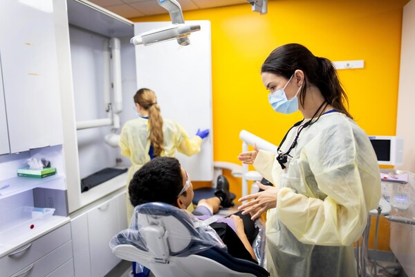 Dental provider talking to a patient.