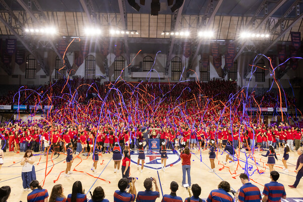 Penn’s class of 2030 in the Palestra with streamers in the air.