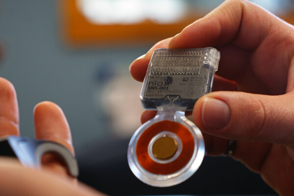 an implantable, handheld therapy device