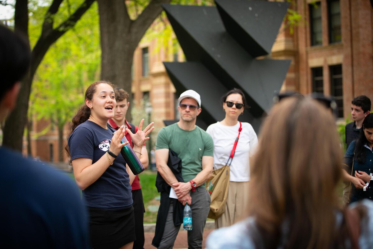 Gabrielle Fine leads a campus tour with prospective students and their families.